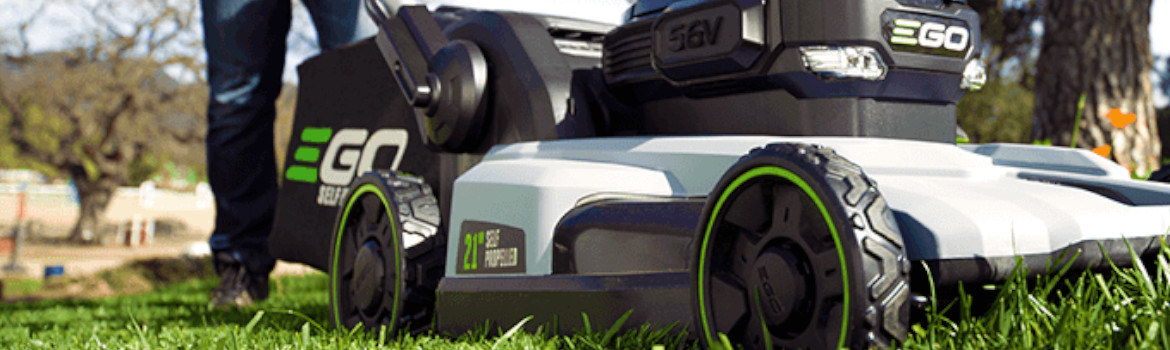 A closeup view of a 2019 EGO LM2100SP lawn mower cutting grass on a field.